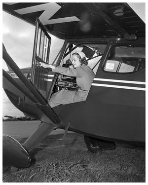 Primary view of object titled 'Woman in cockpit of airplane'.