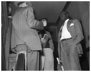 Primary view of object titled 'Young African American talking to Reporter'.