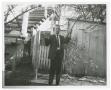 Photograph: [Detective Brown in Backyard With Rifle #1]