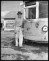 Primary view of Man next to street car (close up)