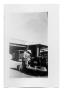 Thumbnail image of item number 1 in: 'A 1948 Lincoln Continental being filled with gas'.