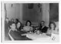 Thumbnail image of item number 1 in: 'Group of people around a table'.