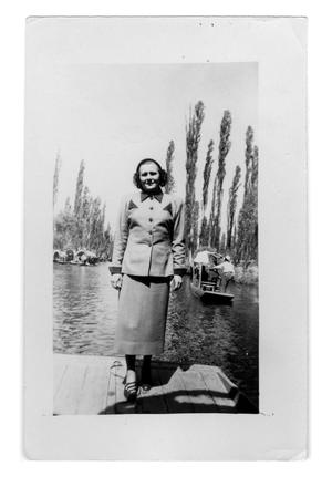 Primary view of object titled 'Woman stands on a dock'.