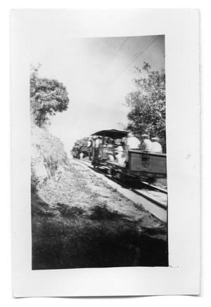 Primary view of object titled 'People on a rail car'.