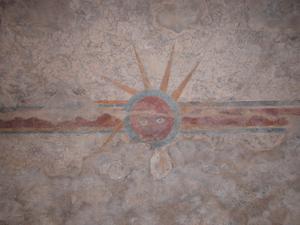 Primary view of object titled 'Detail of decorative painting on stucco at Mission Concepción, a sun'.