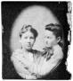 Photograph: Portrait of two girls embracing