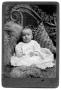 Photograph: Portrait of a baby in a dress