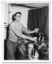 Photograph: Man in a kitchen pouring a drink