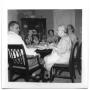 Photograph: Members of the Lewis and Vise family reunited at a dinner table