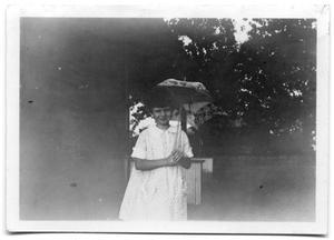 Primary view of object titled 'Cora Lee Vise holding an umbrella'.