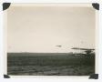 Photograph: [Plane parked on field]