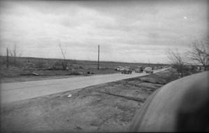 Primary view of object titled 'Cars Driving After Tornado'.