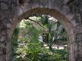 Primary view of Grounds of the Alamo through an archway