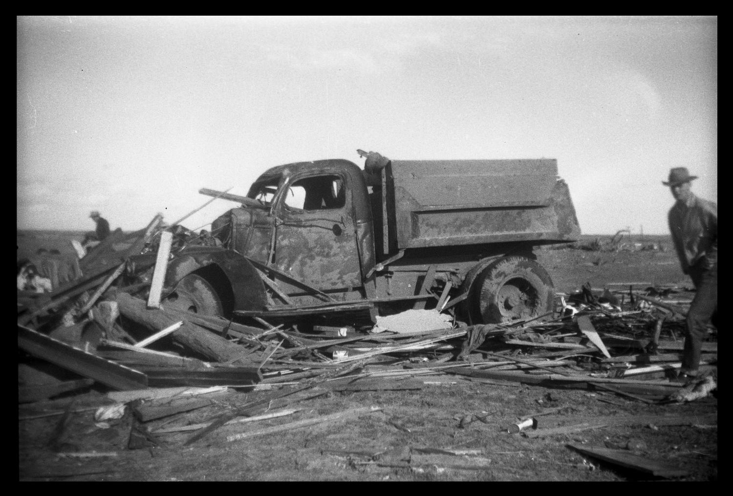 [Photograph of Man and Damaged Truck]
                                                
                                                    [Sequence #]: 1 of 1
                                                