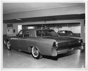 Primary view of object titled '[1961 Lincoln Continental in Showroom]'.