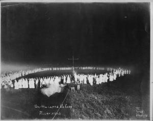 Primary view of object titled '[Ku Klux Klan initiation. "One Hundred Percent Americans" written on photo.]'.