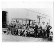 Photograph: [13 men in front of truck]