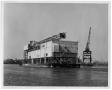 Photograph: [Building and derrick on water]