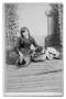 Photograph: [Young Lillian Josephine Harris sitting next to dog]