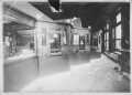 Thumbnail image of item number 1 in: '[The interior of the J.H.P. Davis Bank, Richmond, TX. View of the teller booths.]'.