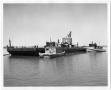Photograph: Barge P9016 with Workers and Tugboats
