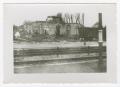 Photograph: [Photograph of Ruined Building Across Railroad Tracks]