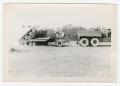 Photograph: [Photograph of a Tank Partially on a Carrier]