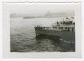 Photograph: [Boat Called Miss America Sailing Toward a City]