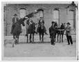 Photograph: [Men on horses with dogs]