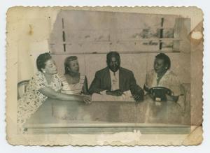 Primary view of object titled '[Group of People at a Table]'.