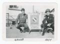Photograph: [Soldiers Kneeling by Sign]