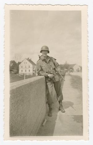 Primary view of object titled '[Carl Tielsch Holding a Carbine]'.