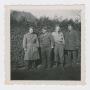 Photograph: [Officers by a Hedge Row]