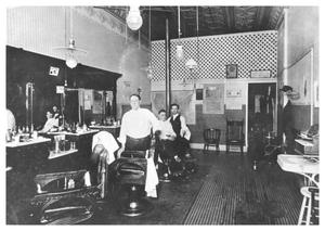 Primary view of object titled '[The Interior of a Barber Shop]'.