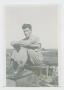 Photograph: [Soldier Sitting on Tank]
