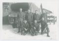 Photograph: [Seven Soldiers by a Truck in Snow]