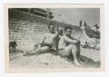 Photograph: [Three Men Reclining on a Beach in Nice, France]