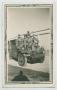 Photograph: [Five Soldiers and a Dog on the Hood of a Scout Car]