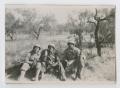 Photograph: [Three Soldiers Sitting in a Lightly Wooded Field]