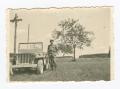 Photograph: [Harry Parsloe Leaning on a Jeep]