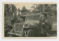 Photograph: [Two Soldiers by Jeep]
