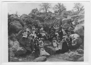 Primary view of object titled '[People Sitting on Rocks]'.