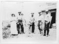 Photograph: [Group of people outside a house]