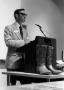 Thumbnail image of item number 1 in: '[Don Newport speaking boots in photo]'.