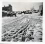 Photograph: [Street scene with snow and buggies]