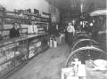 Photograph: [General store interior with buggies]