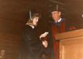 Photograph: [Photograph of Student Walking Across Stage]