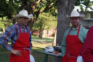 Primary view of object titled '[Photograph of Cooks Gary Fraser and Aaron Moncla at Western Heritage Day]'.
