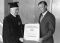Photograph: [Photograph of Elwin Skiles with Certificate]