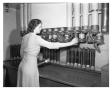 Thumbnail image of item number 1 in: '[Dorothy Keys Operating Tube Station in the Mail Room]'.